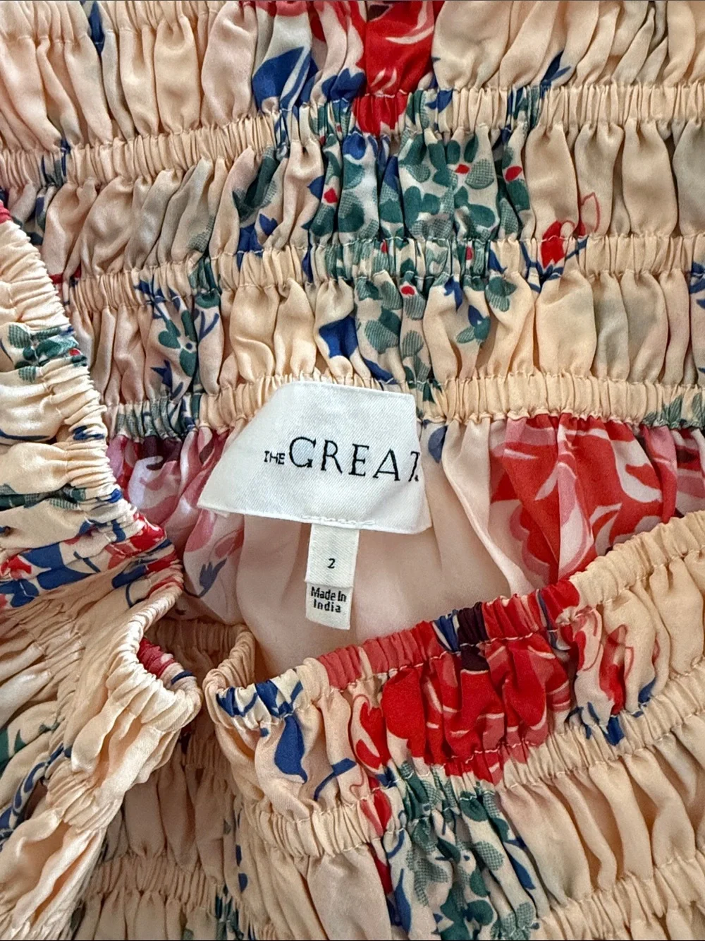 THE GREAT. Smocked waist cream skirt with Red Floral Print